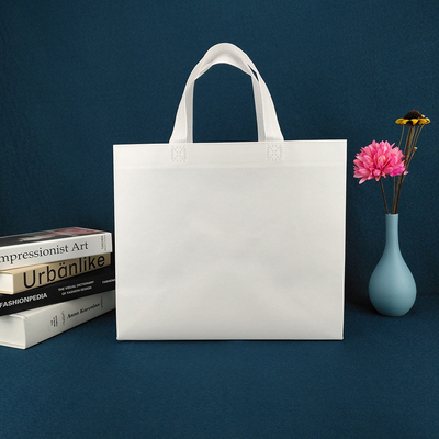 Bolsos de empaquetado amistosos del eco del totalizador del paño que hacen compras para la ropa biodegradable del logotipo de encargo blanco de los paños no tejida cortada con tintas