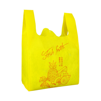 Bolso no tejido reutilizable respetuoso del medio ambiente reciclable amarillo de la camiseta de las compras