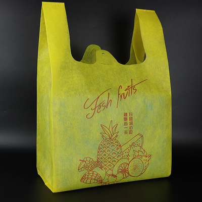 Bolso no tejido reutilizable respetuoso del medio ambiente reciclable amarillo de la camiseta de las compras