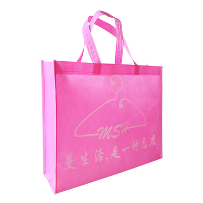 Los bolsos que hacen compras no tejidos rosados plegables del polipropileno 75gsm encogen resistente